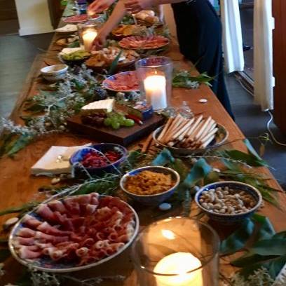 buffet table with a large number of antipasti and salads and cheese platters